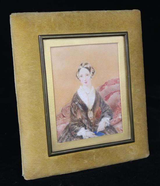 Victorian School, a watercolour miniature portrait of a young lady